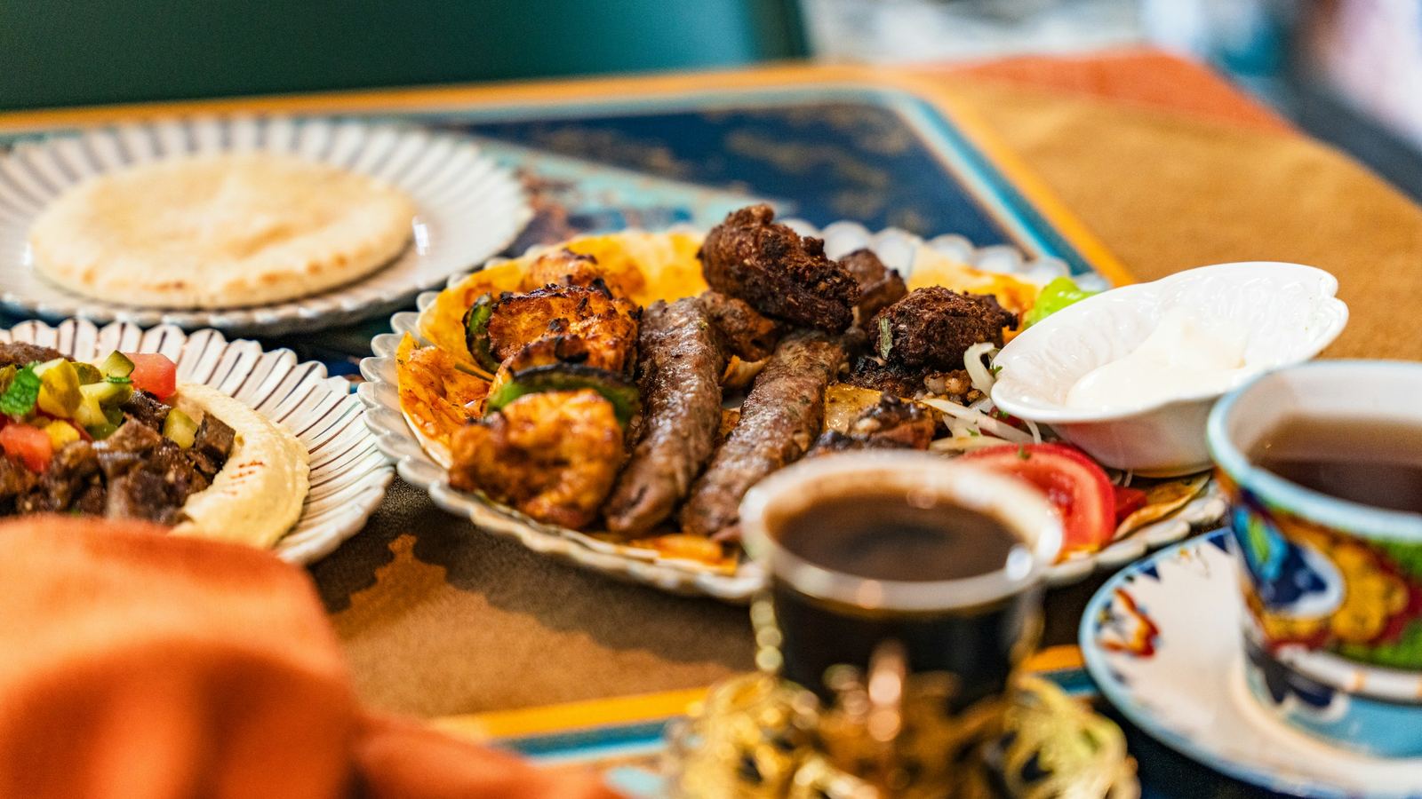 Grilled kofta and chicken with rice, flatbread and tea