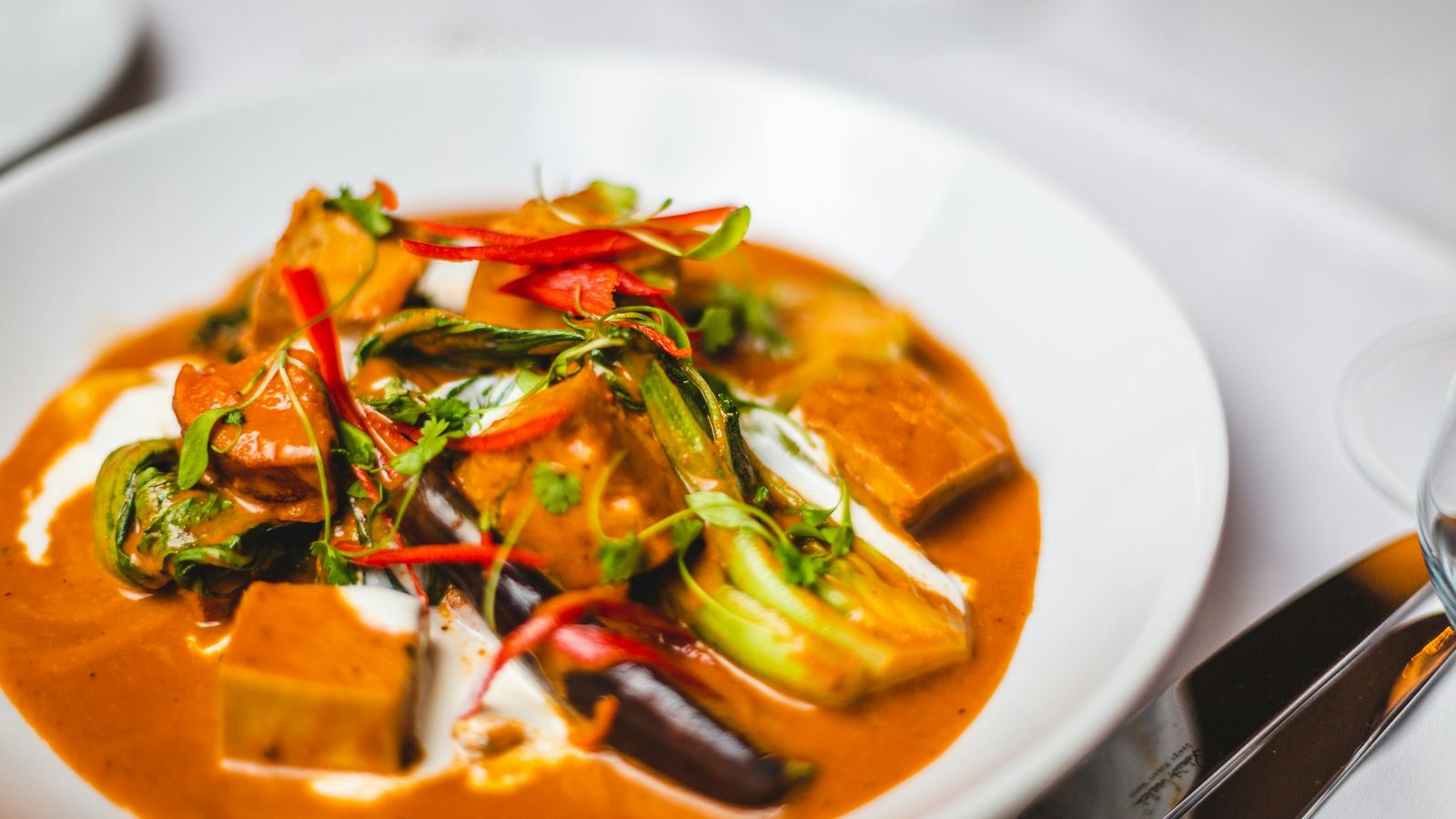 A vegetable curry with tofu, pak choi and red chilli